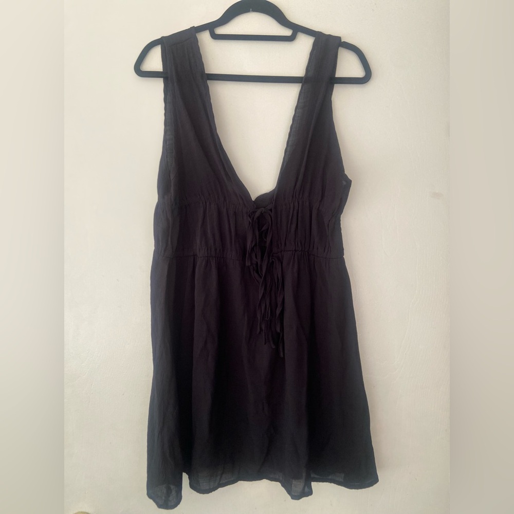 Black dress swim suit covering.